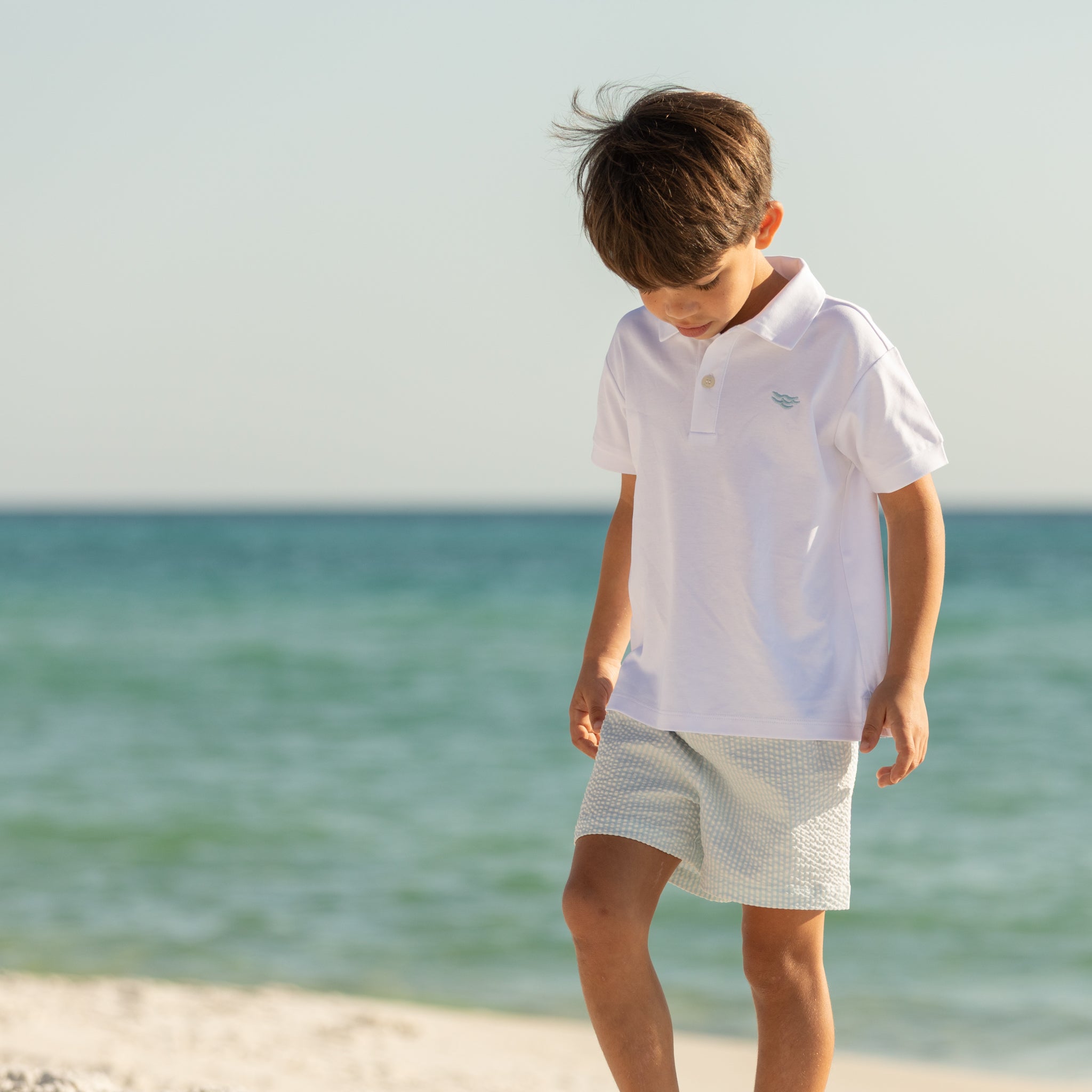 Henry Duvall boys white polo shirt with light blue embroidered logo, a classic preppy polo designed for everyday wear.