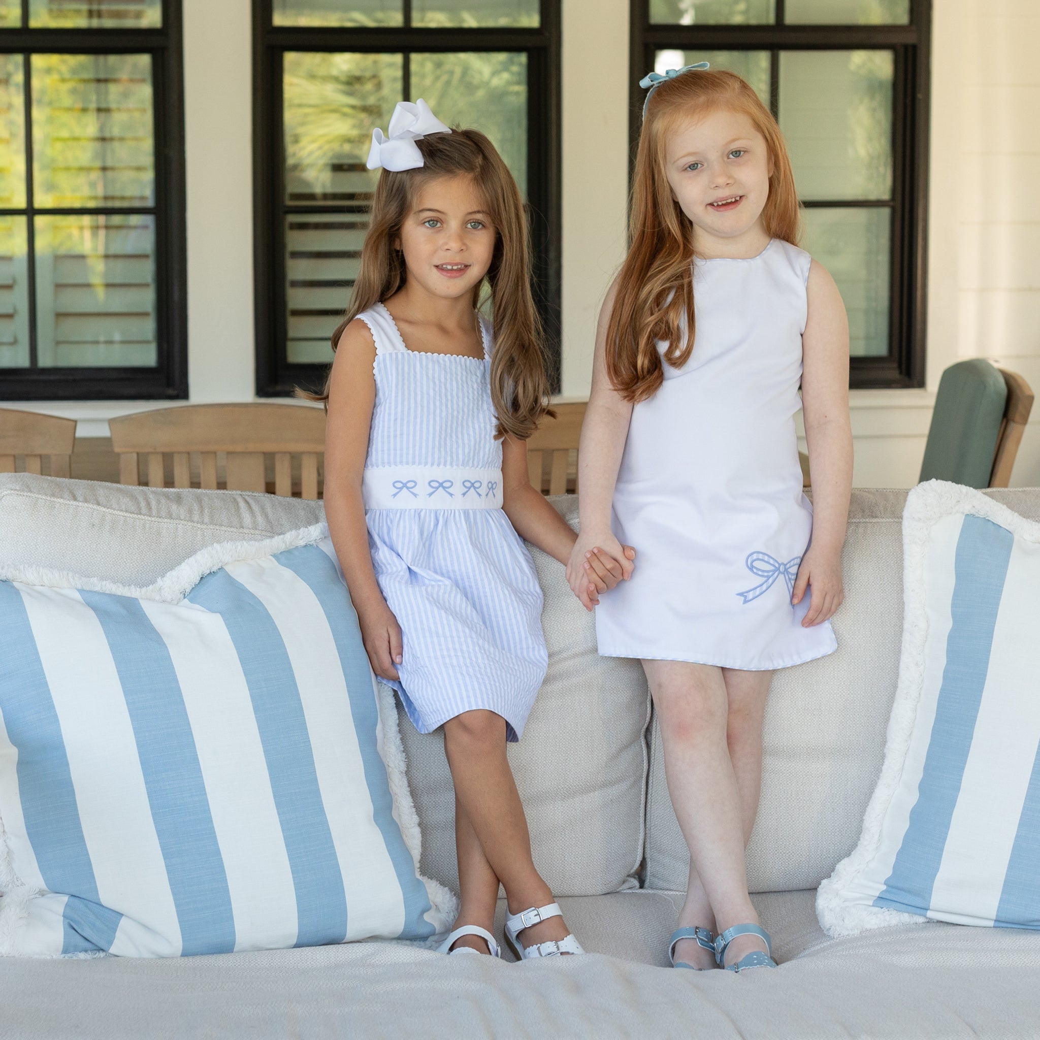 Girl wearing the Henry Duvall Schuyler Dress, a classic girls shift dress designed for summer outings and sibling matching.