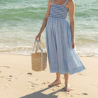 Henry Duvall curated Ridgely Tote by Breck & Grier, a classic straw tote bag with woven body and vegan leather handles.