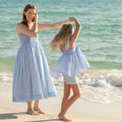 Girl wearing the Henry Duvall smocked shorts set in South Charles Stripe, a classic girls outfit designed for warm weather and family photos.