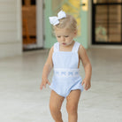 Baby girl wearing the Henry Duvall Sutton Sunsuit in Seaside Stripe, a classic summer outfit designed for warm weather and sibling matching.