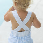 Back view of Henry Duvall Sutton Sunsuit showing criss-cross straps with ric rac trim on a classic baby girls sunsuit.