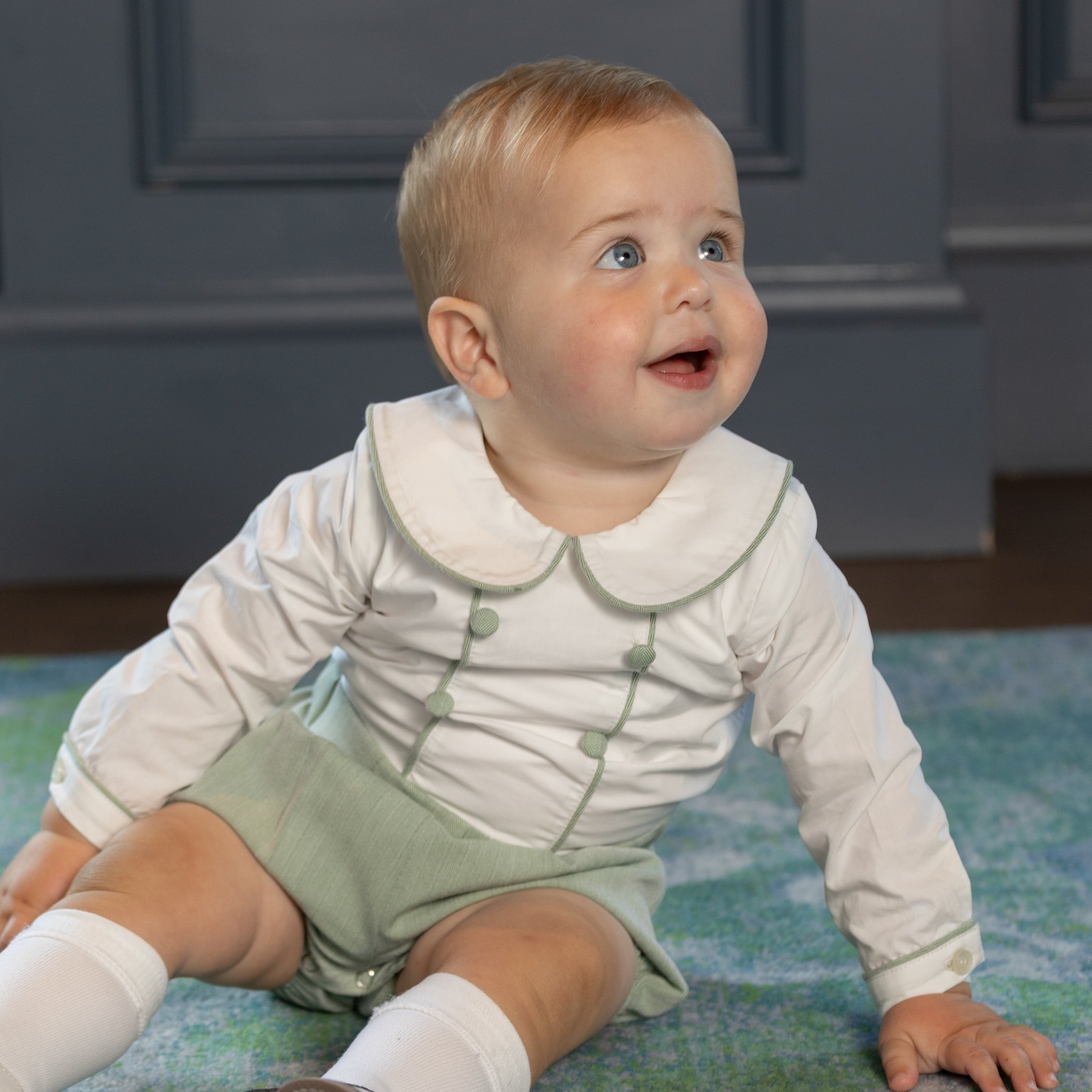 Classic baby boy bubble romper in sage green herringbone fabric, inspired by English heritage style, heirloom-quality traditional boys clothing for portraits, holidays, and special occasions