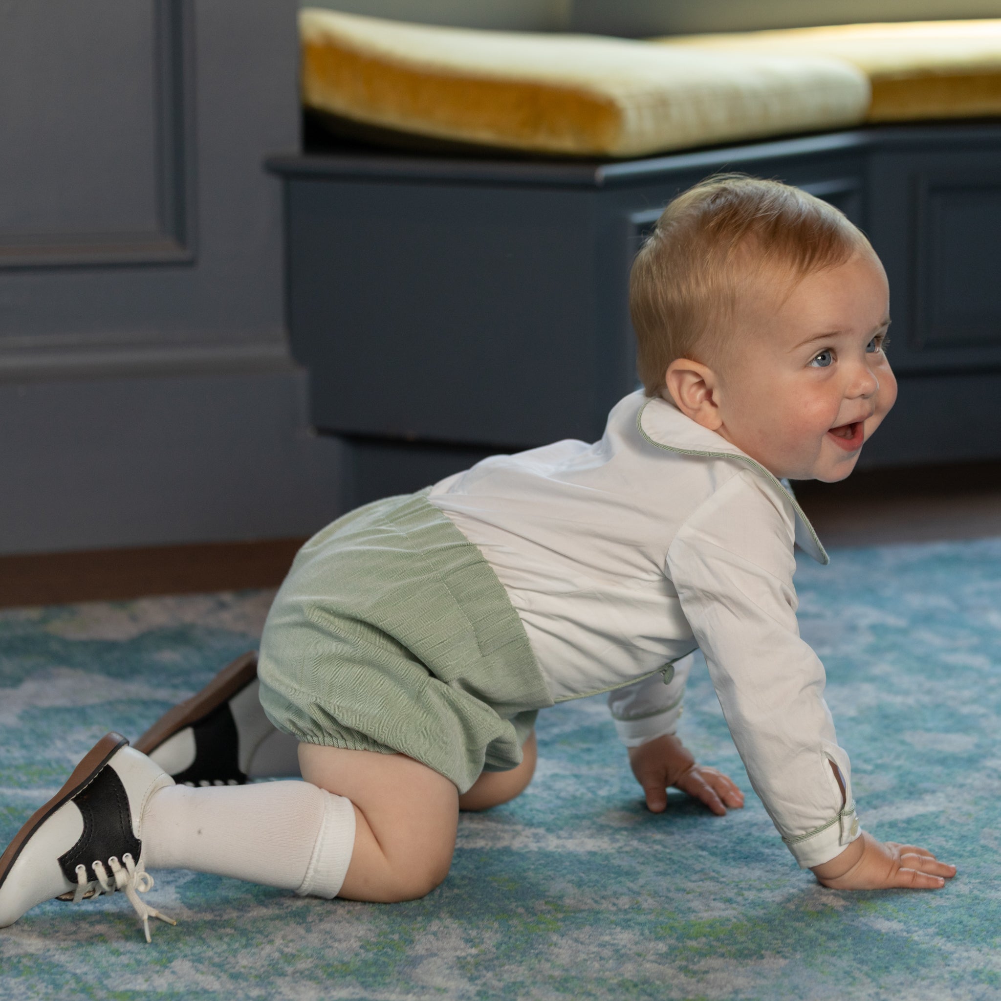 Classic baby boy bubble romper in sage green herringbone fabric, inspired by English heritage style, heirloom-quality traditional boys clothing for portraits, holidays, and special occasions