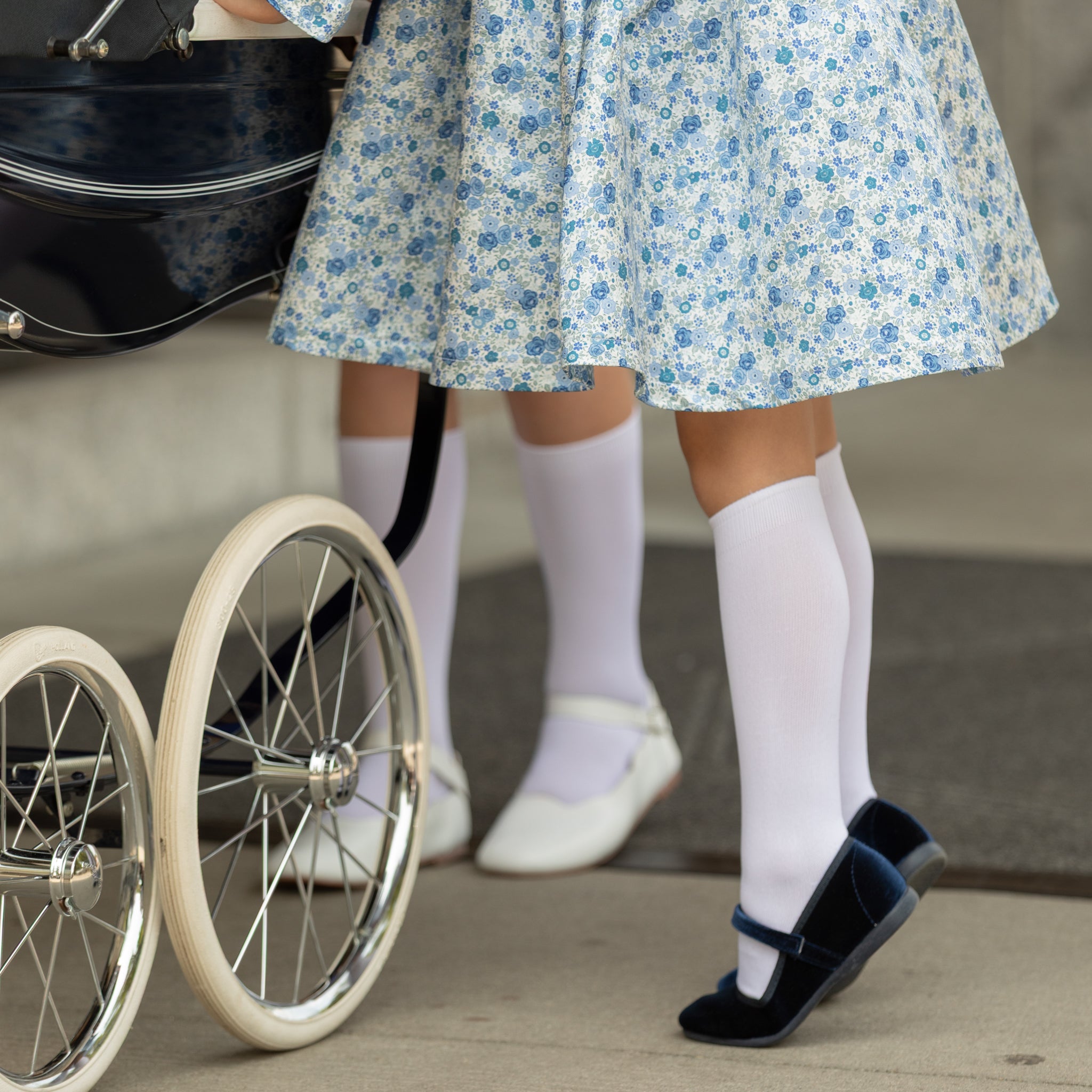 Classic white nylon knee high socks for girls and toddlers, lightweight with ribbed stay-up top, designed for comfort and perfect fit, ideal for pairing with Mary Janes or dress shoes from Henry Duvall’s Fall Collection