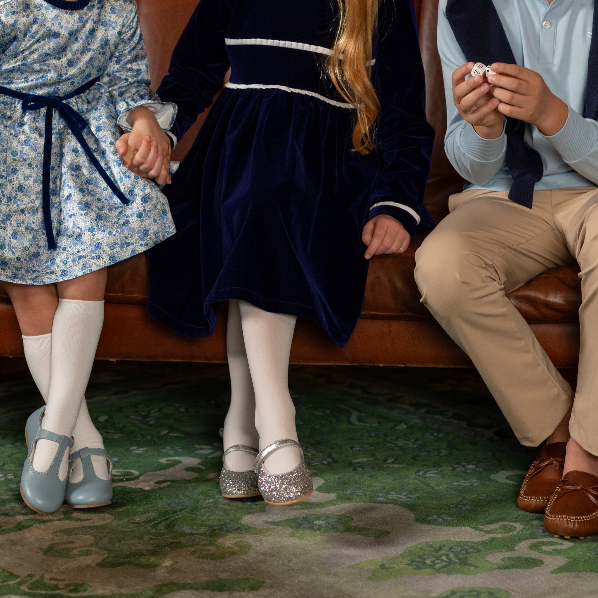 Girls long sleeve navy velvet party dress with white pleated details and pre-tied back bow, perfect for fall family photos and special occasions from Henry Duvall