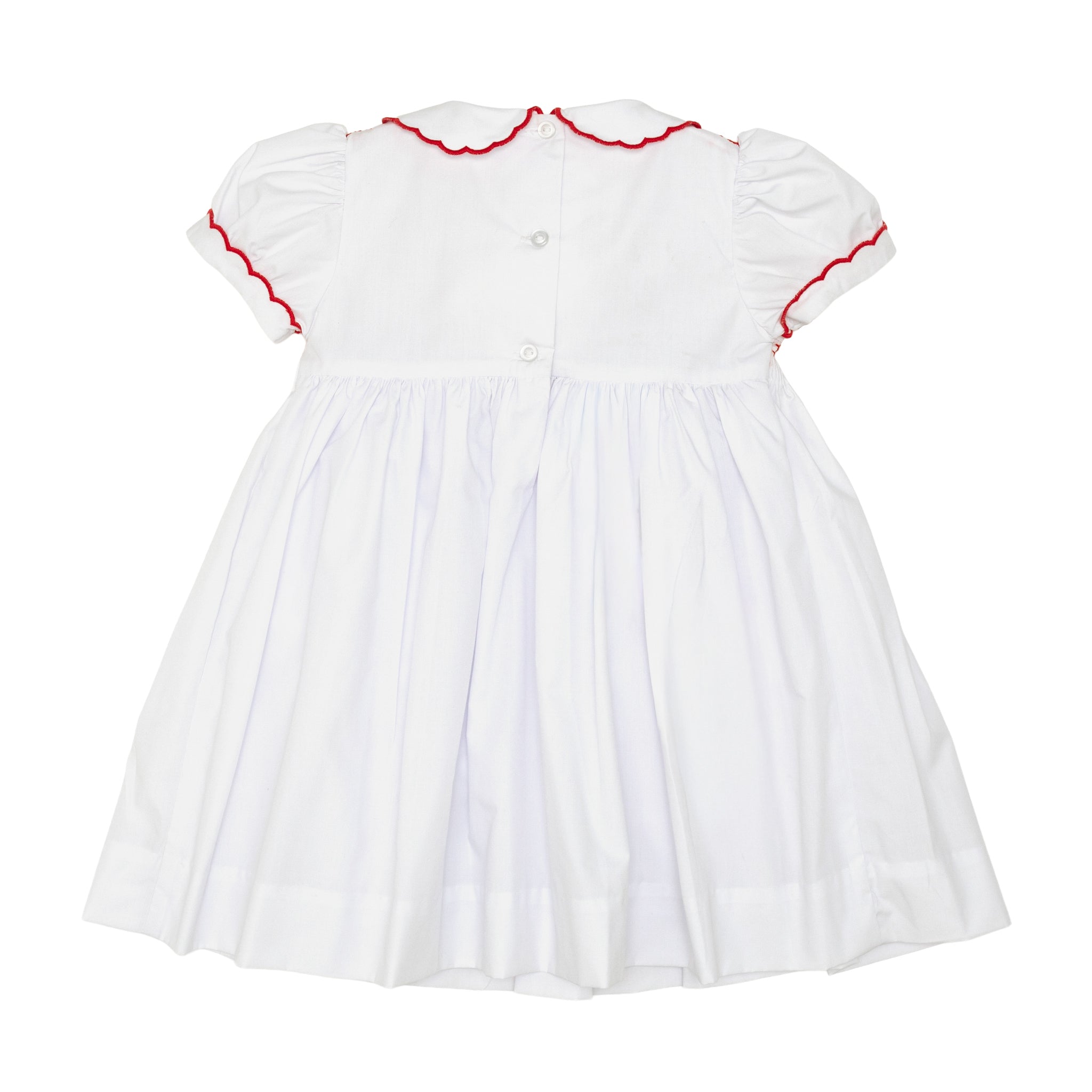 White short sleeve girls' holiday dress with red bow smocking across the chest, Peter Pan collar, and piped cuffs, classic Henry Duvall Eloise Dress for Christmas and winter family gatherings