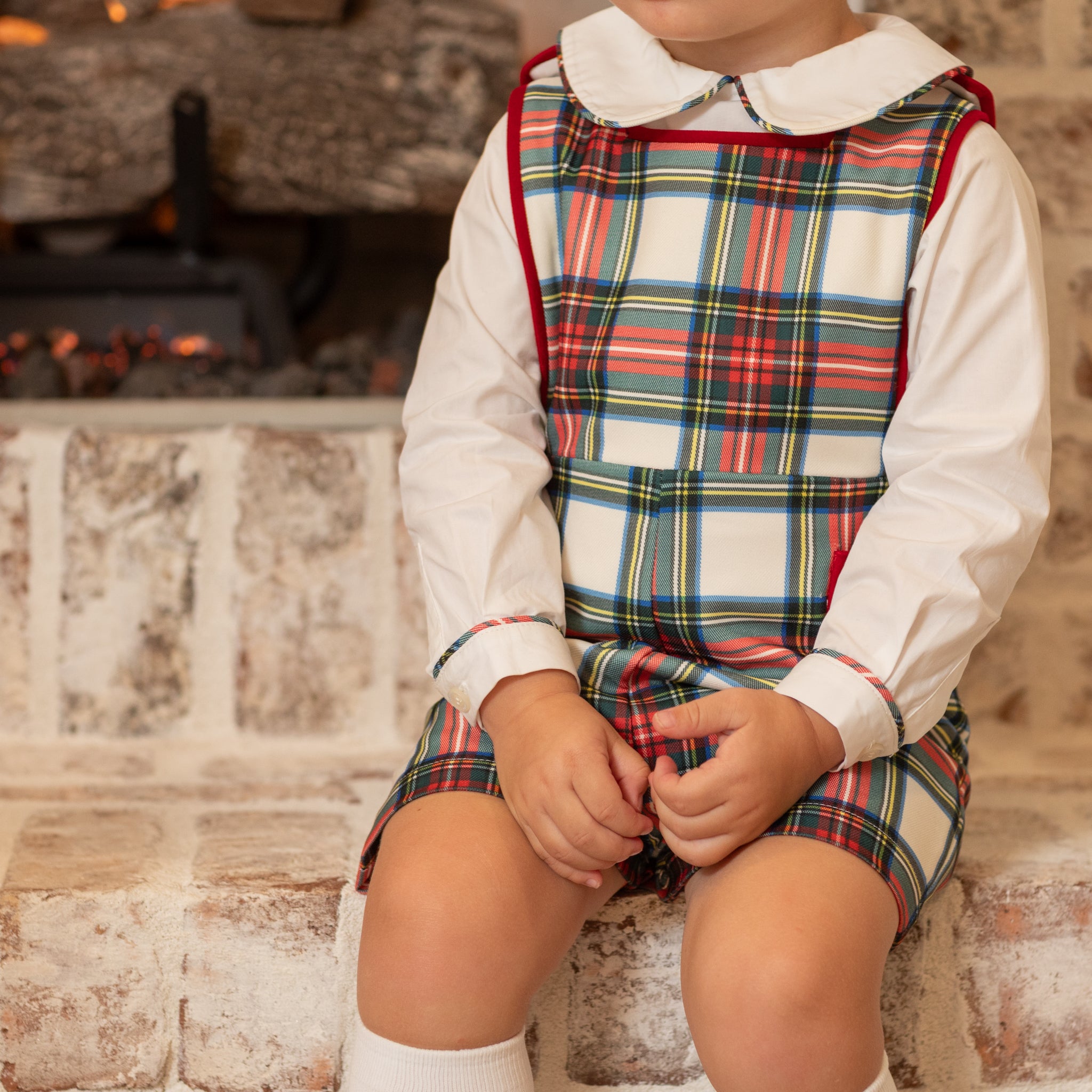 Classic white Peter Pan collar top highlighted with bold Townsend Tartan trim. A signature holiday piece from Henry Duvall’s Holiday Collection.