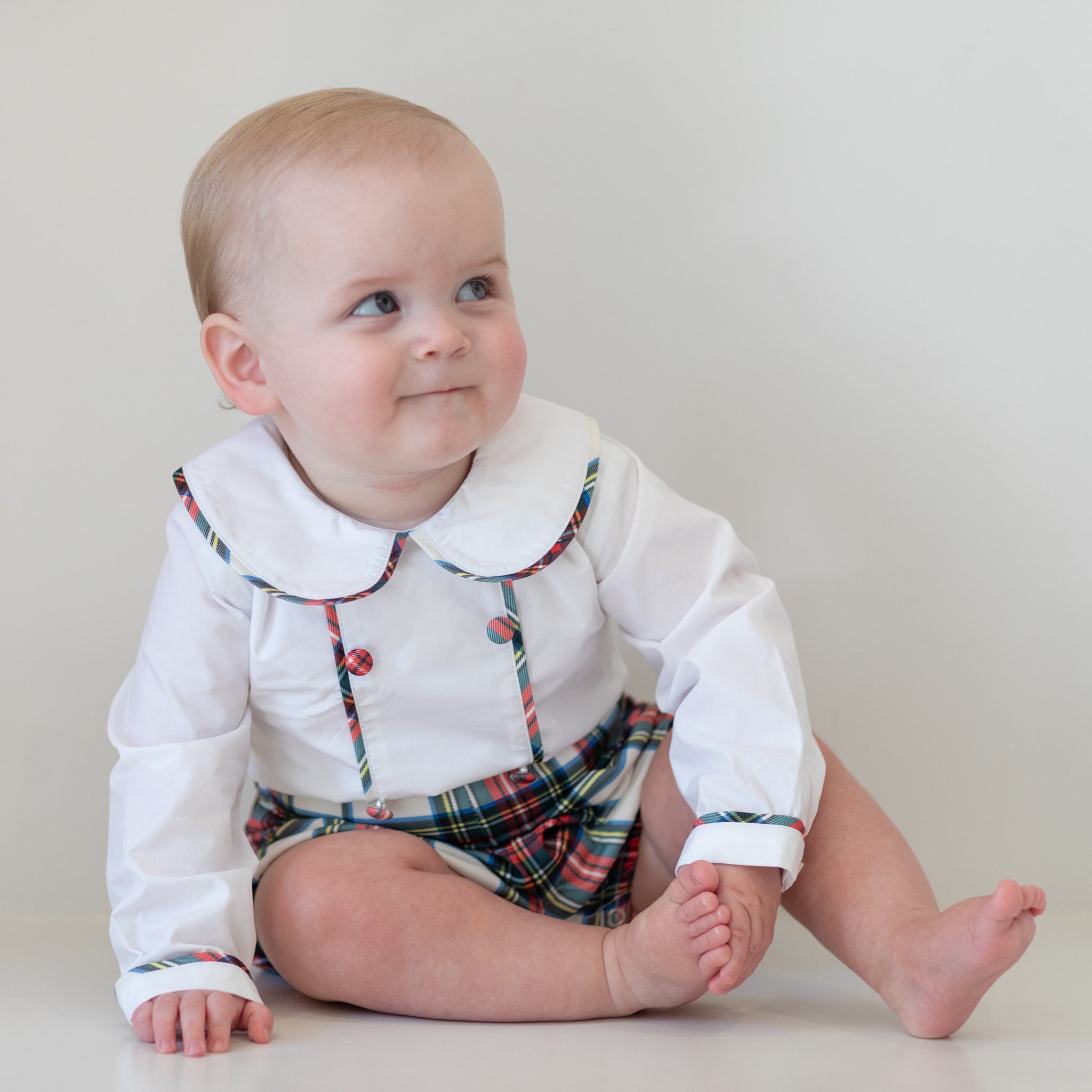Classic baby boy bubble in traditional red Townsend Tartan with long white sleeves, boy holiday outfit with plaid for family photos