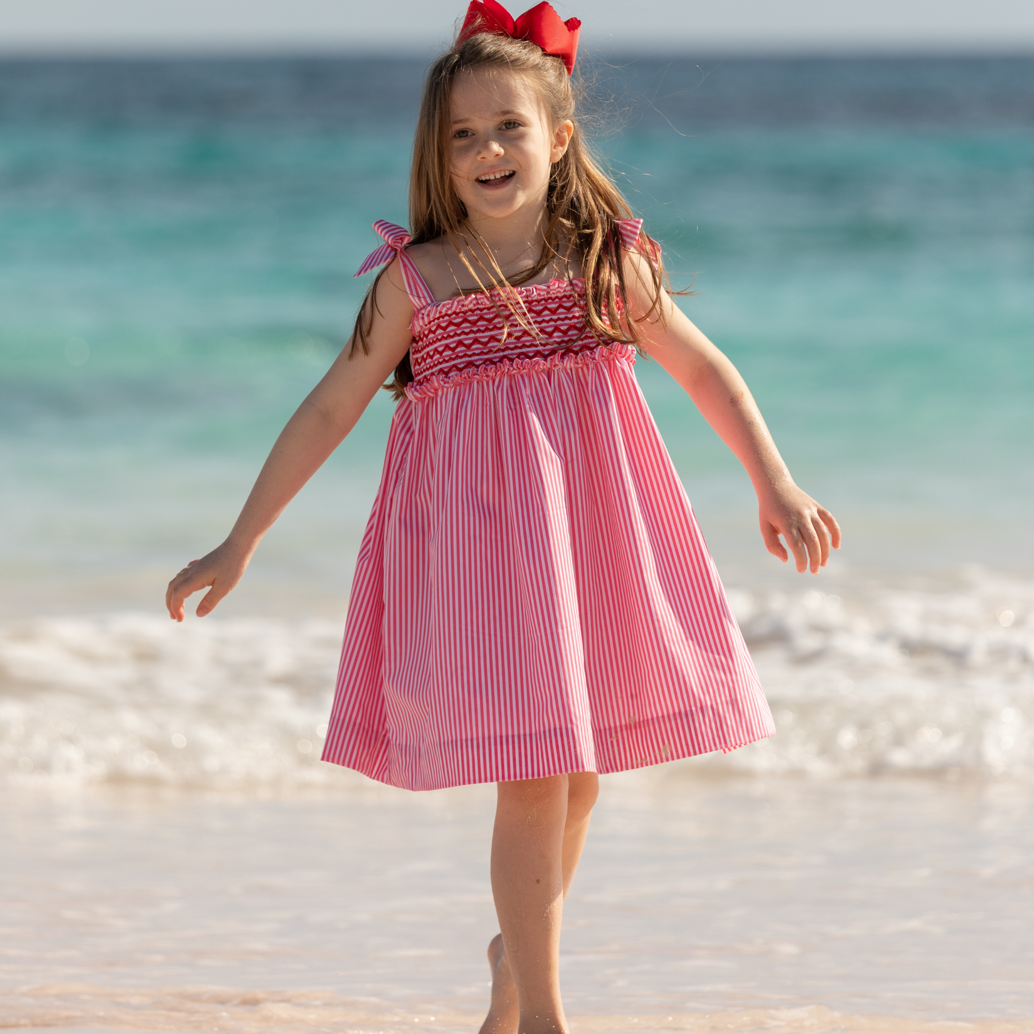 Henry Duvall Daisy Dress in Sconset Stripe print with hand-smocked bodice and shoulder bow ties, classic heirloom summer dress for girls