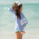 Stylish Henry Duvall x Line + Cleat infant life jacket in blue star print with neck pillow support, zipper front, and adjustable straps