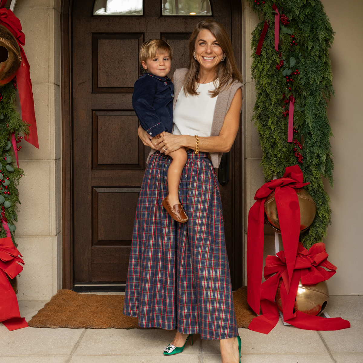 Women’s Audrey Skirt in navy, red, and green Tinsel Tartan with subtle metallic thread, featuring a full gathered midi-length silhouette.