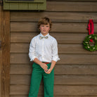 Boys’ Baker Bow Tie in Regent Wreaths, a festive red and green holiday print on a classic white background.
