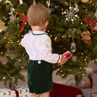 Boys’ Benjamin Button On with crisp white long-sleeve cotton poplin top, Grafton Green piping and pintuck details, paired with Grafton Green Velvet shorts and signature HD buttons.