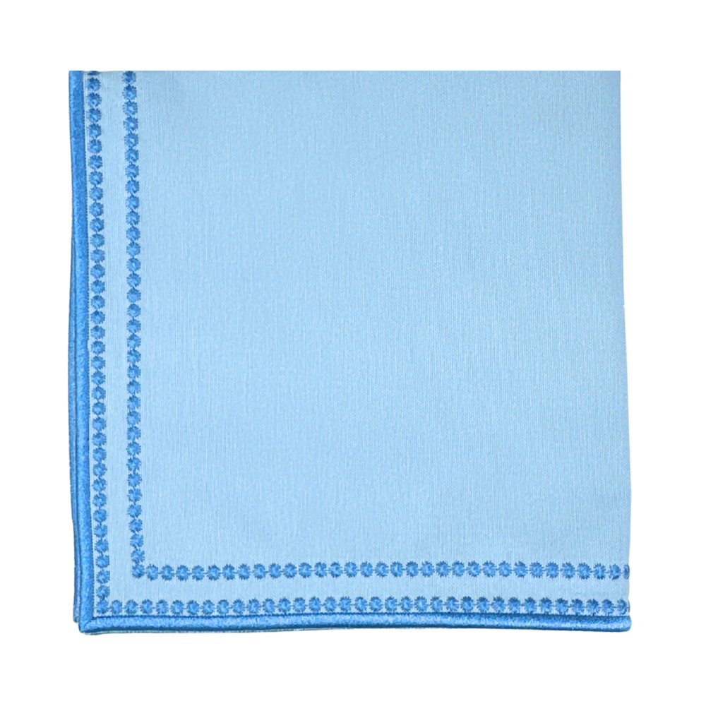 Light blue pocket square with a subtle pattern on a white background