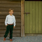Boys’ Bradford Trousers in rich Grafton Green Velvet with a classic tailored fit, belt loops, front and back pockets, and embroidered Henry Duvall logo at the back.