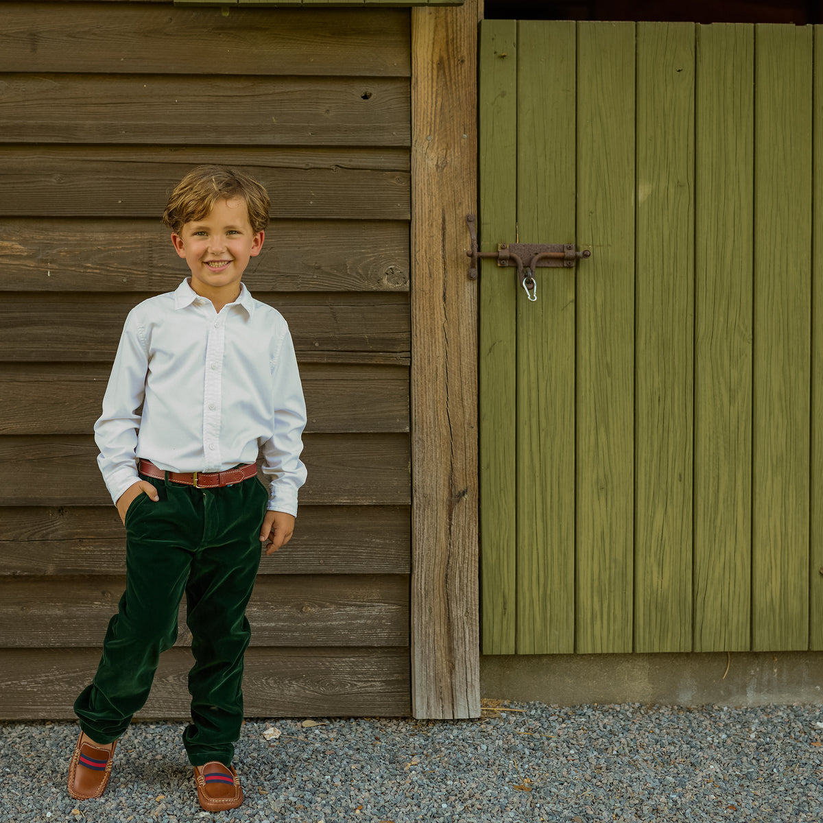 Boys’ Bradford Trousers in rich Grafton Green Velvet with a classic tailored fit, belt loops, front and back pockets, and embroidered Henry Duvall logo at the back.