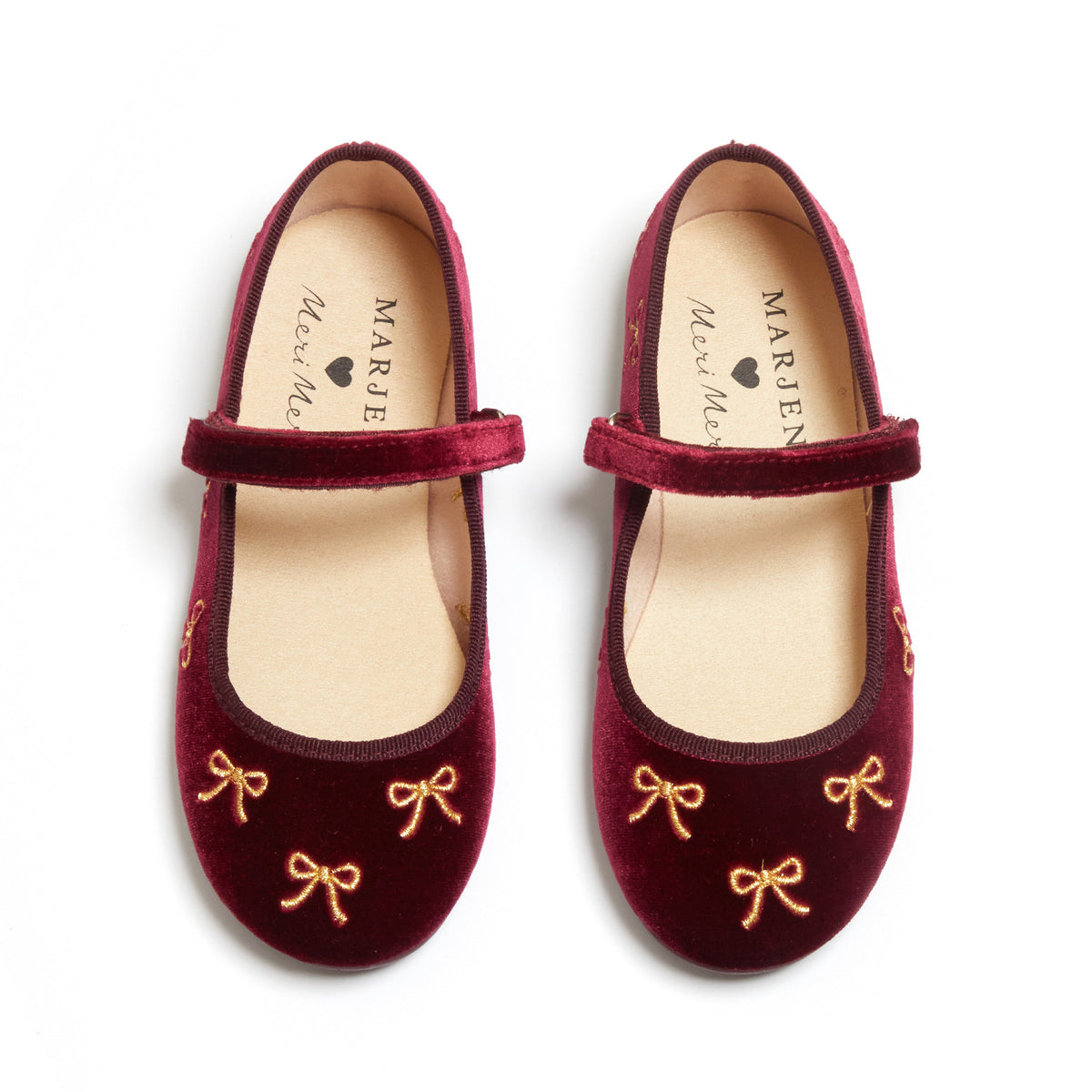 Meri Meri x Marjen Bowie burgundy velvet Mary Jane with gold bow embroidery, top-down view of pair