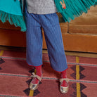 Meri Meri x Marjen Missy metallic gold Mary Jane with velvet bow, worn by child in striped trousers