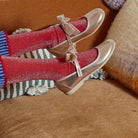 Meri Meri x Marjen Missy metallic gold Mary Jane with velvet bow, worn by child with red glitter socks