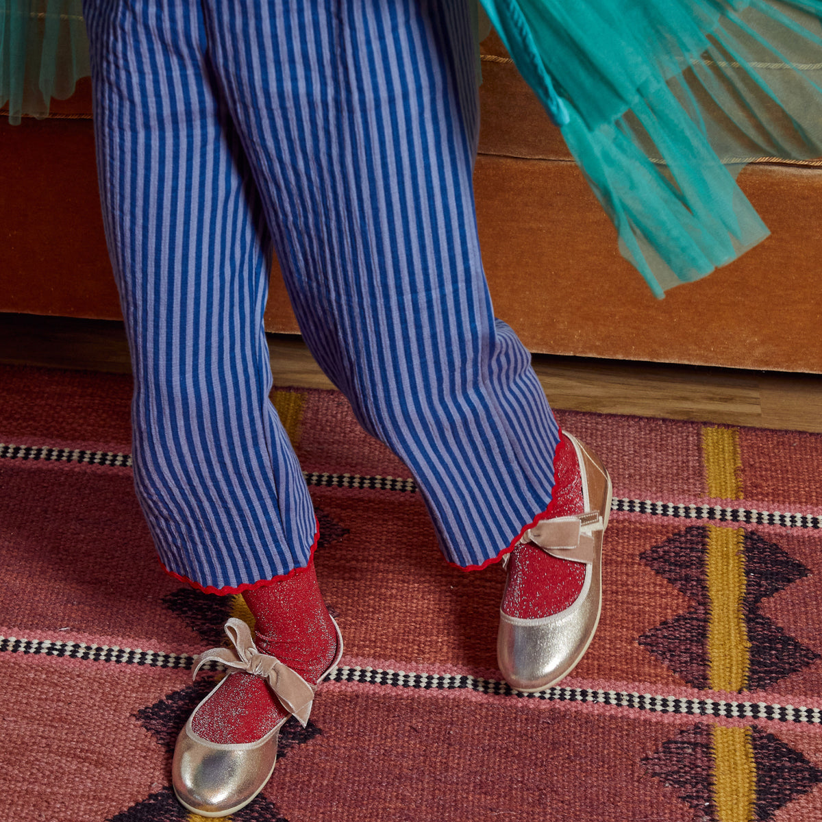 Meri Meri x Marjen Missy metallic gold Mary Jane with velvet bow, worn by child in striped trousers
