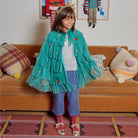 Meri Meri x Marjen Missy metallic gold Mary Jane with velvet bow, child in a teal tulle cape