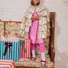Meri Meri x Marjen Sabrina pink glitter Mary Jane with red velvet bow, child in a gold ruffle cape